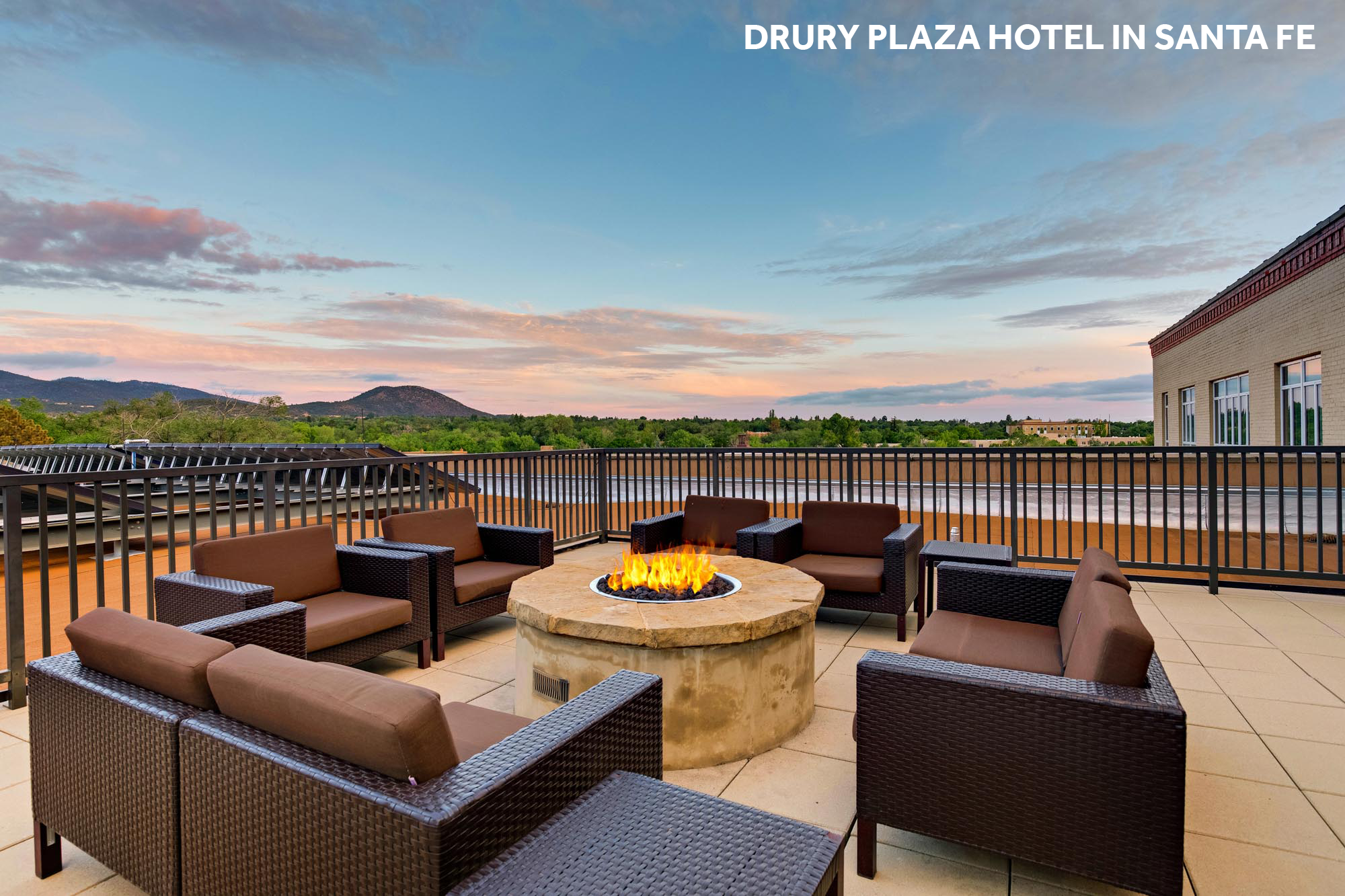 Mountain view from a patio with a fire pit and outdoor seating
