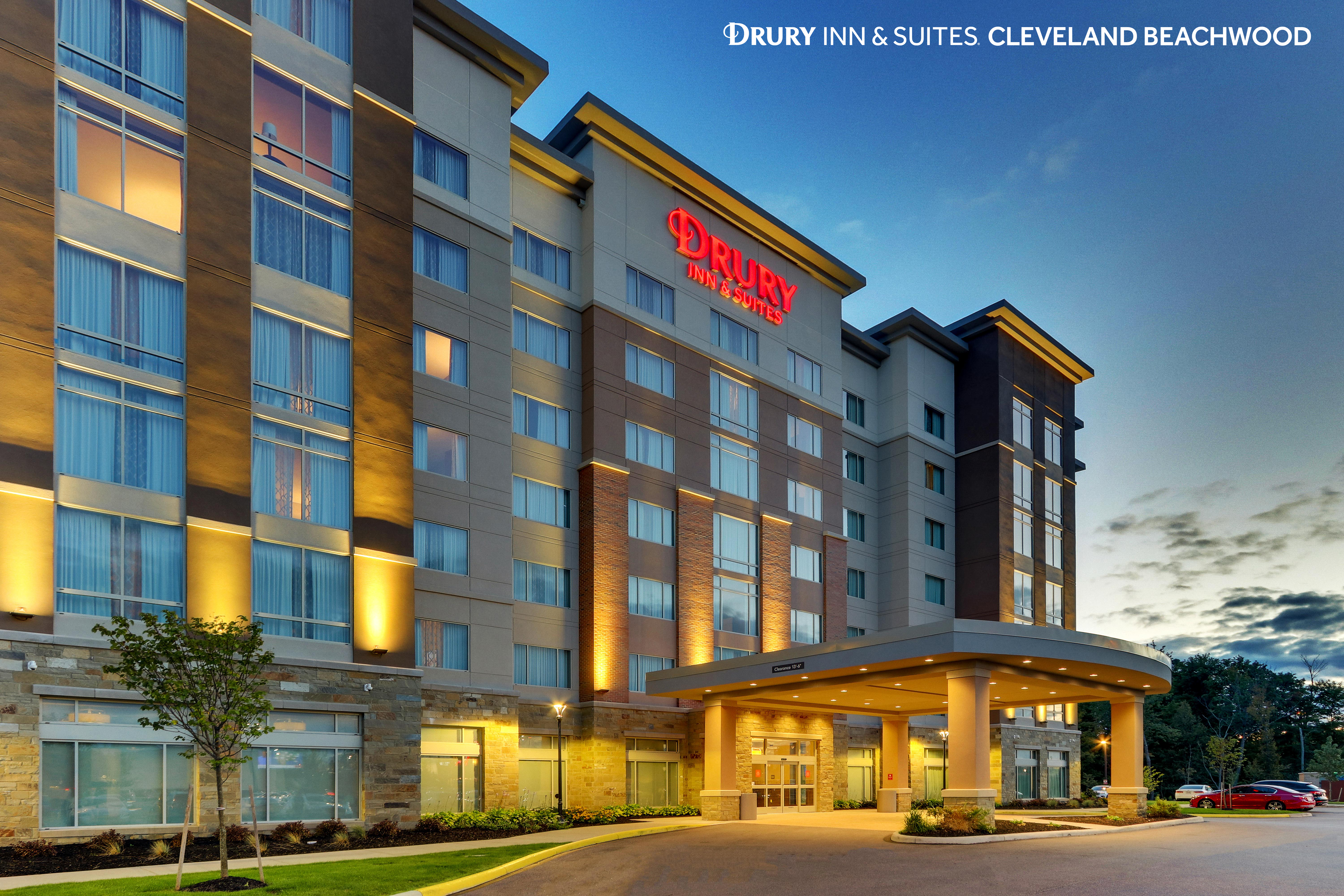 Exterior photo of a Drury Inn and Suites at dusk.